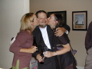 Holly Hassinger McVay and Jenny Estes Varma smooching with Mike Hillerby