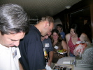 Bill Chissoe, Rick Long, Kristin Larsen, Michelle Olsen Bennett looking at memorabilia