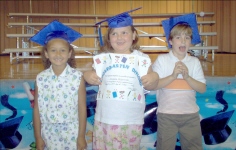 Alexis Bell, Amanda Robinson, and Taylor Rainwater, pose for graduation pics.